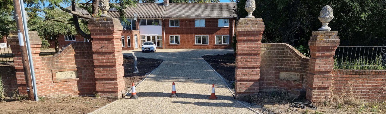 This is a photo of a newly installed chip and tar driveway, installed by Earls Barton Driveways